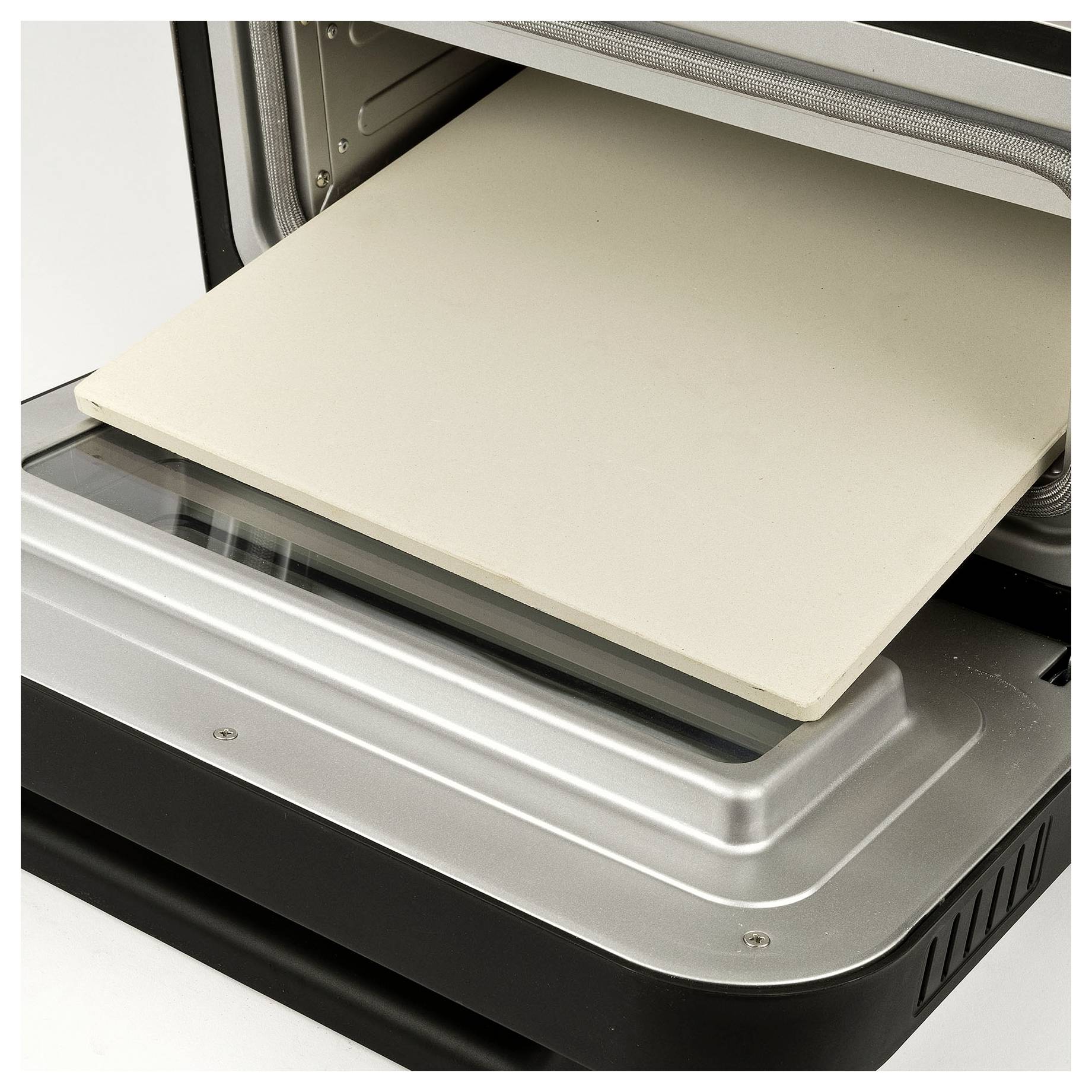 Open 3D printer with a beige build plate on the print bed, ready for printing.