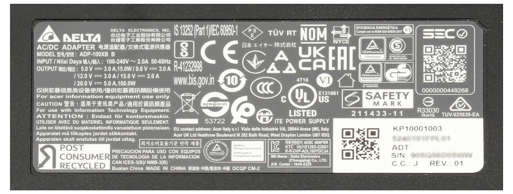 Close-up of a Delta Electronics AC/DC power supply label packed with certification logos, model and electrical specifications, plus QR codes and serial information.<br>