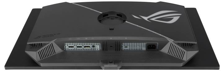 Back view of a black ASUS ROG monitor showing ventilation grilles, cable ports, and the ROG logo on the stand.