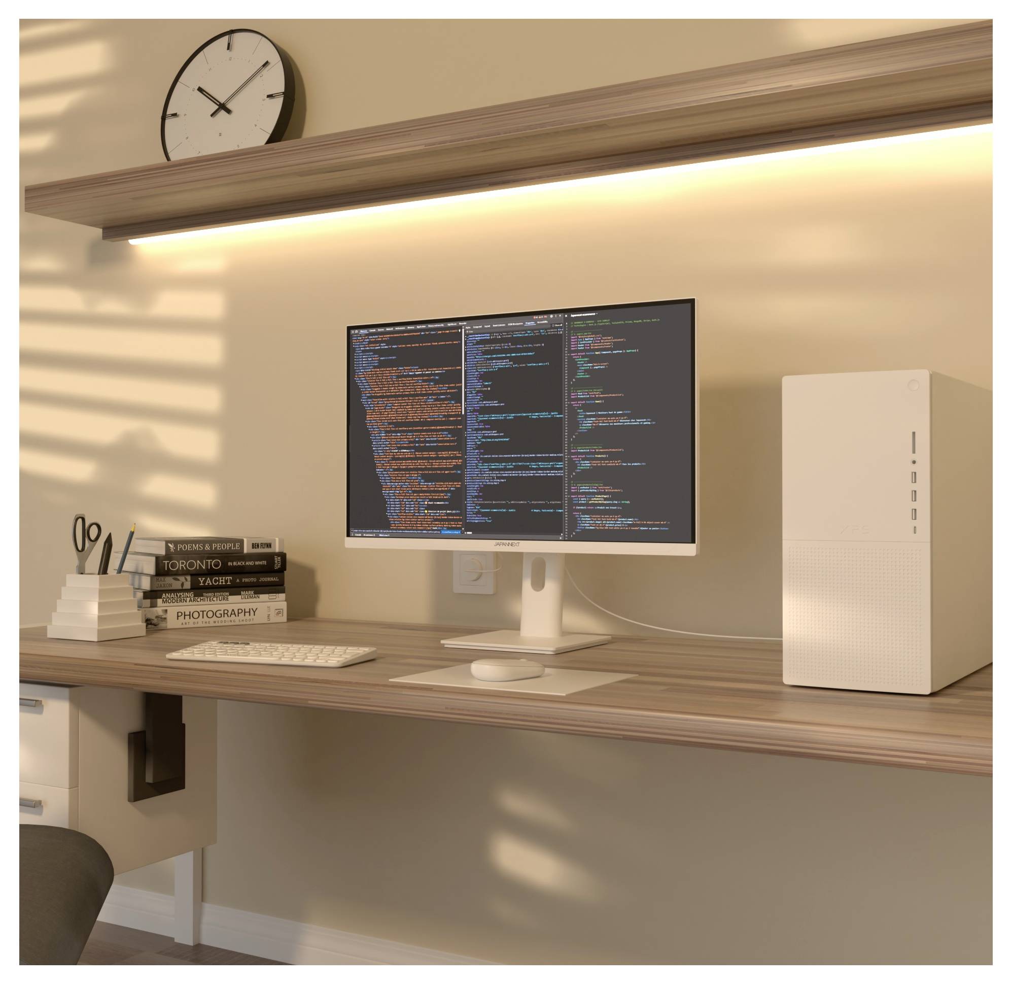 Minimal home office desk with monitor showing code, keyboard, books, wall clock, and white PC tower under warm shelf lighting.
