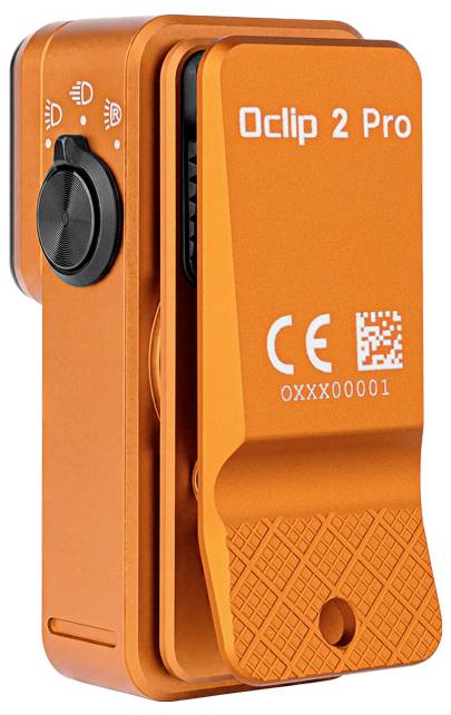Orange Oclip 2 Pro clip-on light with side dial, front clip, and CE marking on a white background.