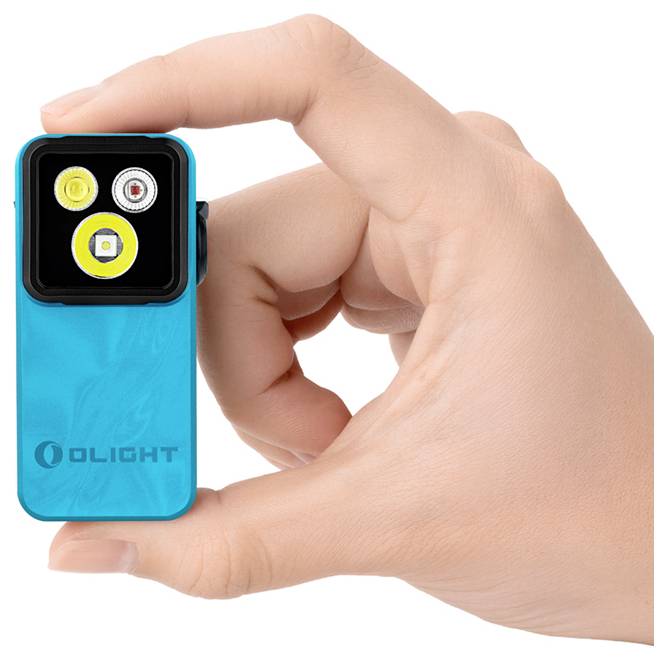 Hand holding a small blue Olight clip-on LED light with three visible lamps on the front.<br>