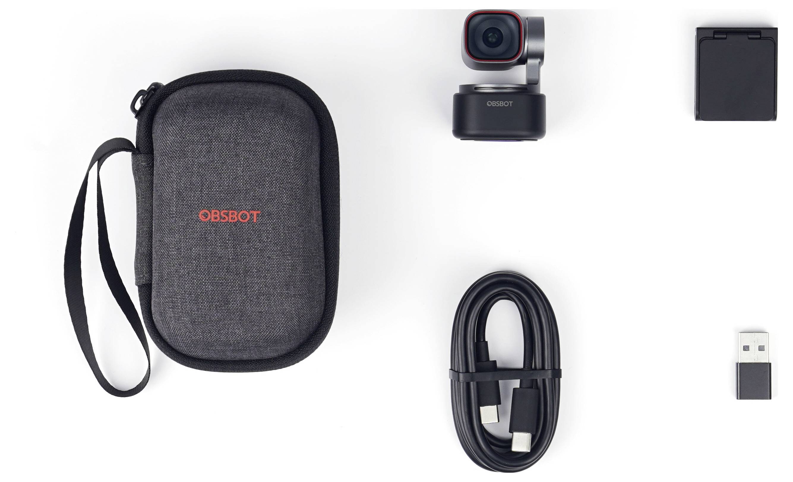 OBSBOT camera kit laid out on white background: carrying case, compact camera, battery, USB cable, and USB adapter.<br>
