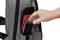 A hand is placing a smartphone into the side pocket of a grey rucksack.