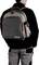 Person from behind with a grey backpack with red details. The backpack has a printed 'MAGMA' logo. The person is wearing a black jacket.