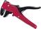 Red wire strippers with a black handle, suitable for removing insulation from electrical cables.