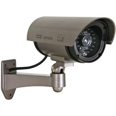 'Dummy surveillance camera mounted on the wall, made of silver metal, with lens housing and cable, used as a deterrent.'