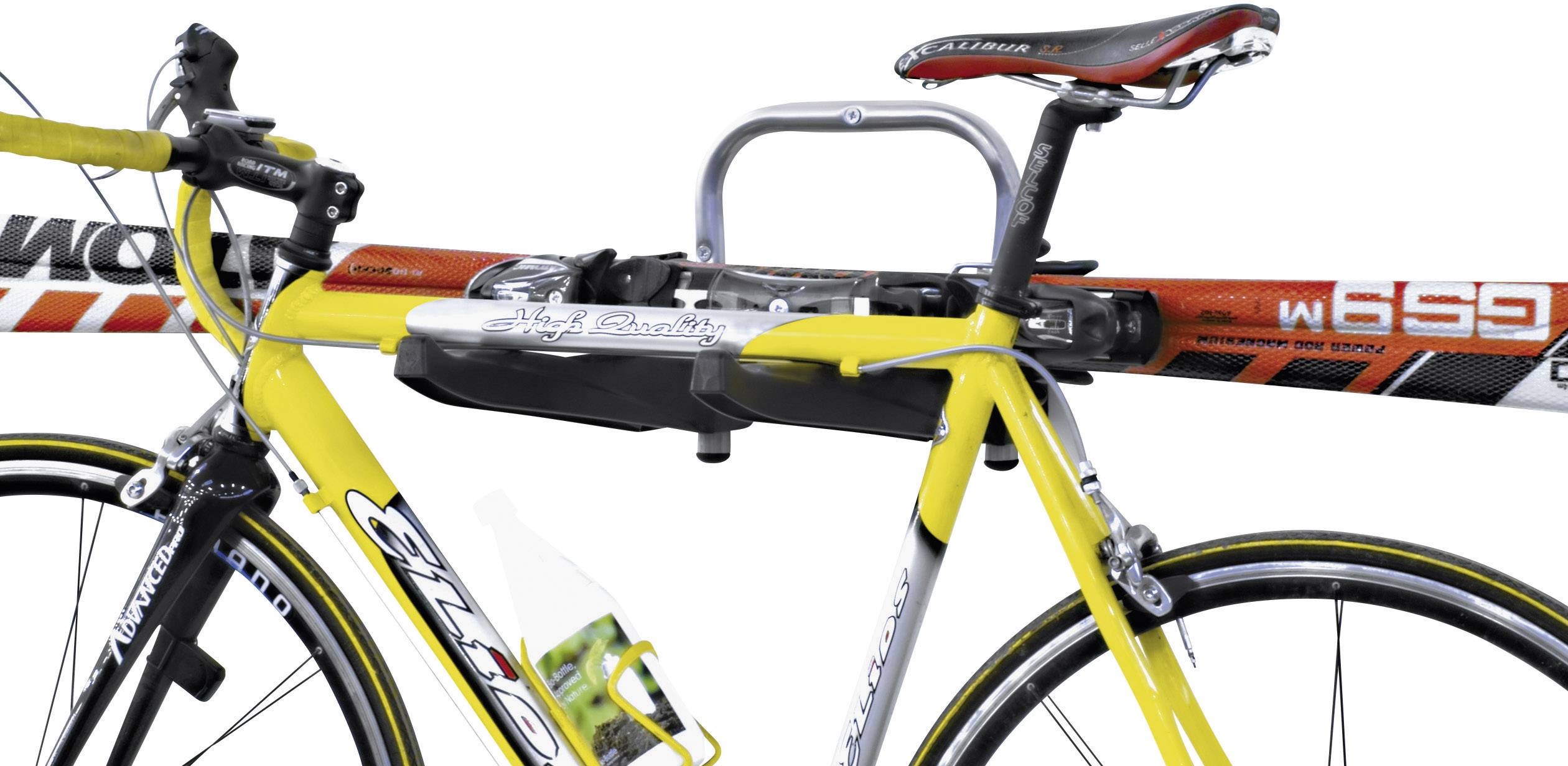 Yellow bicycle with a water bottle holder, attached to a mount that also holds an elongated piece of sports equipment.