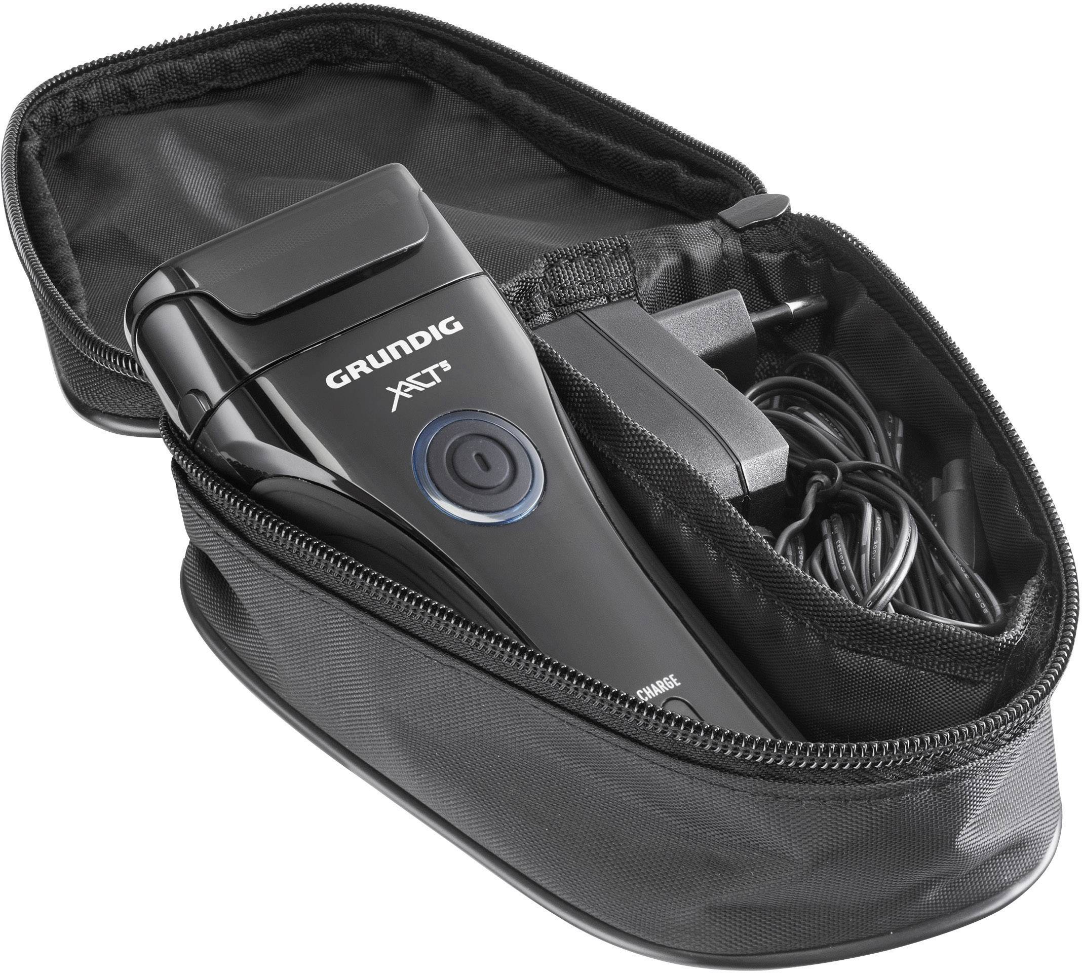 Electric razor in an open black case with charger and cable.