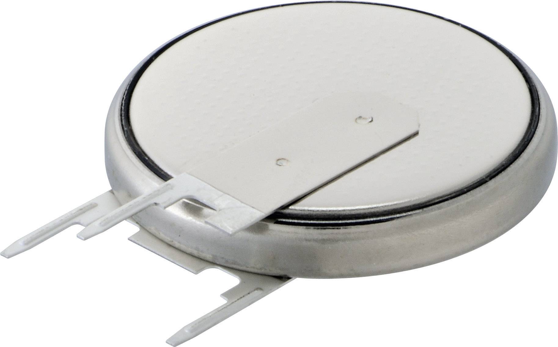 Round lithium button cell with two metal terminals, lying on a white surface. Suitable for use in electronic devices.