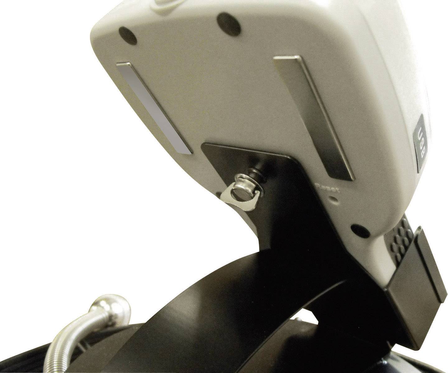 Device with USB port on stand, viewed from below. A switch is visible.