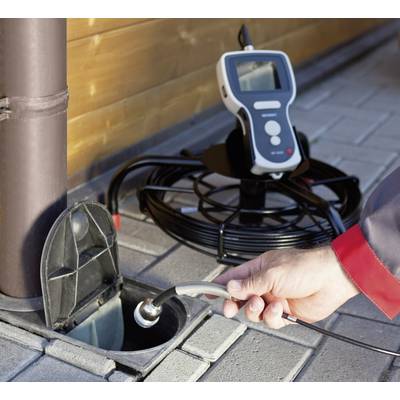 'A technician is conducting an inspection with a drain camera in a drainage pipe.'