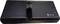 The image shows the back of an electronic device with a battery compartment in the centre and symbols for CE marking and waste sorting.