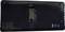 The back of an electronic device, presumably a battery cover, with CE marking and a small sliding switch.