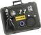 A black case containing tools for measuring instruments. Included are a device with handles, a round device, two adapters, a cable, adhesive tape, and a yellow 'Fluke' logo.