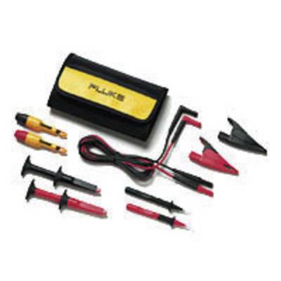 A collection of electronic test leads and clips next to a case labelled 'Fluke'.