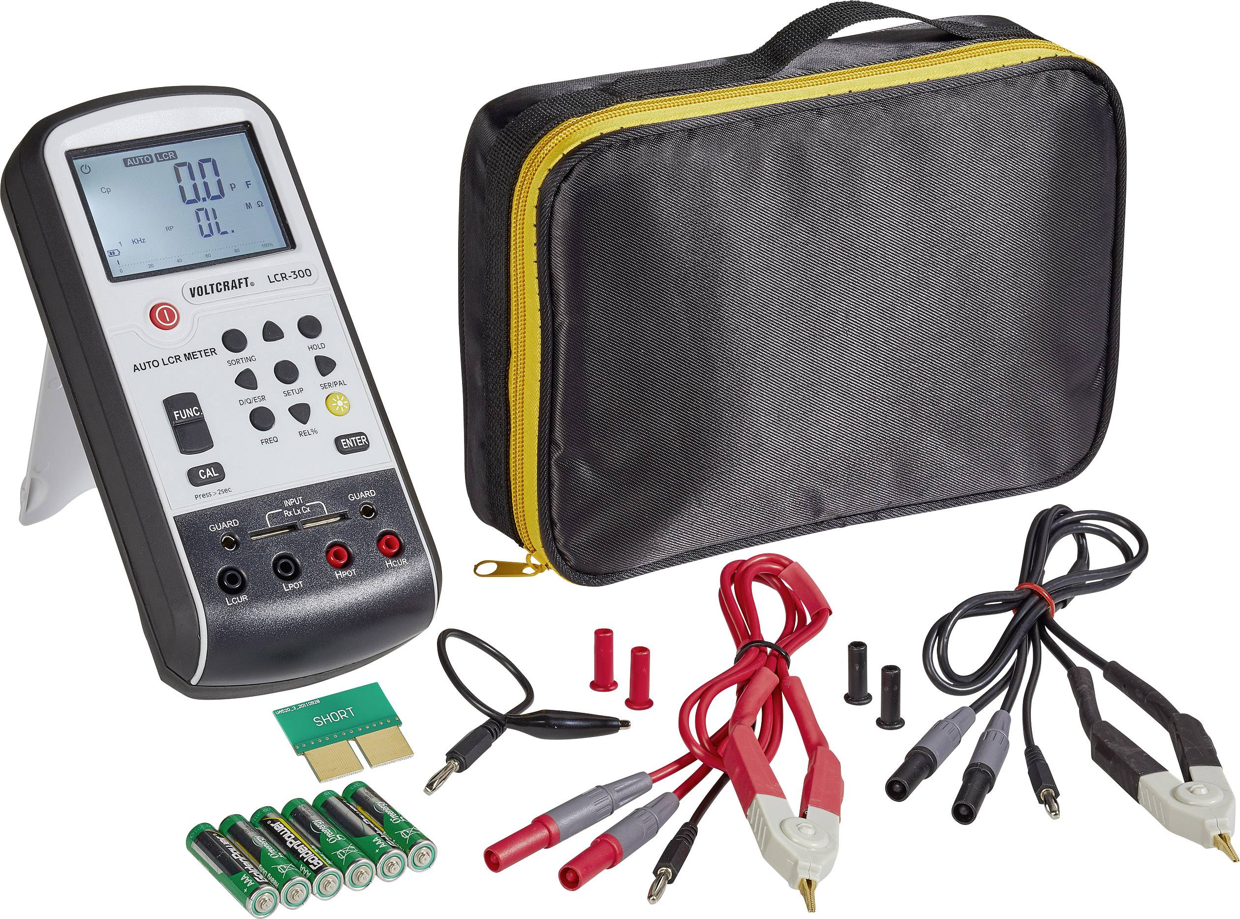 A digital multimeter with accessories and carry case. Includes test leads, batteries, and connection plugs for measurements.