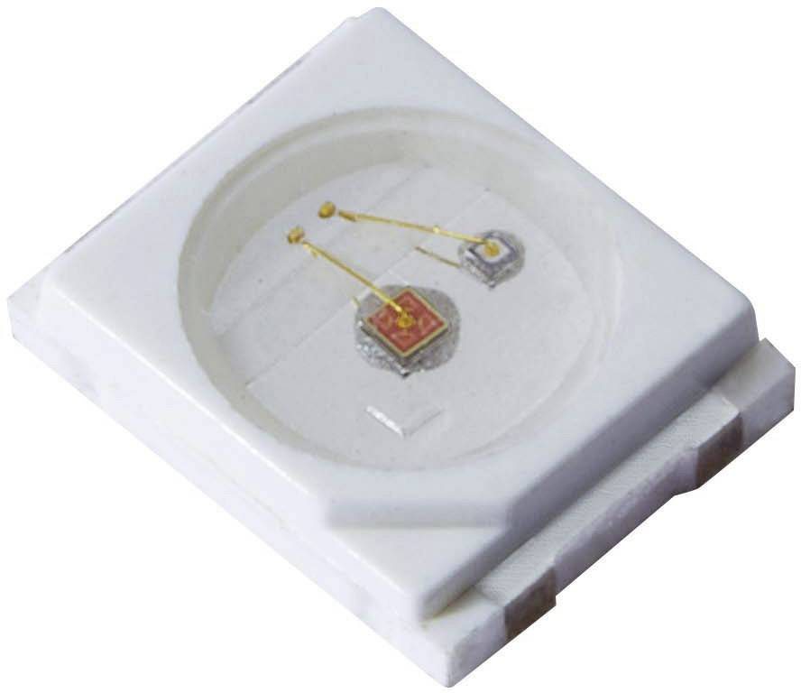 A white, square LED housing with two silver and one golden contact in the centre.
