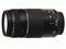 A black telephoto zoom lens with markings for focal lengths from 75–300 mm. It has controls for autofocus and manual focusing.