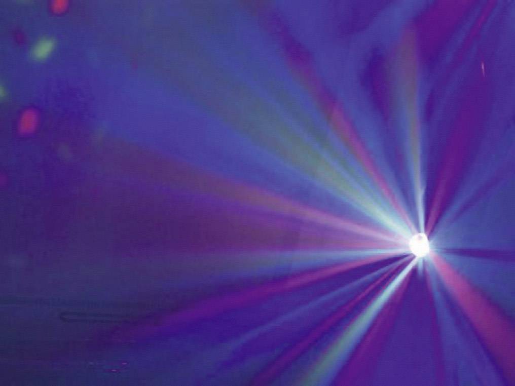 Colourful rays from a light projector converge at a central point, creating a luminous effect against a blue-violet background.