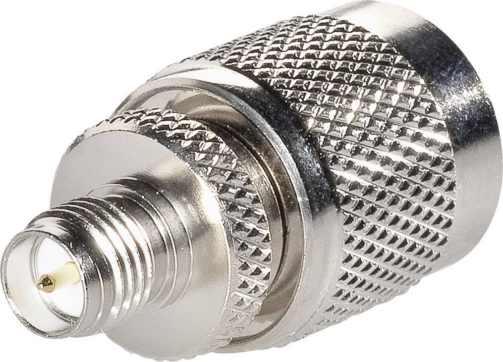 A silver coaxial adapter with a knurled surface, used for connecting cables in electronic devices.