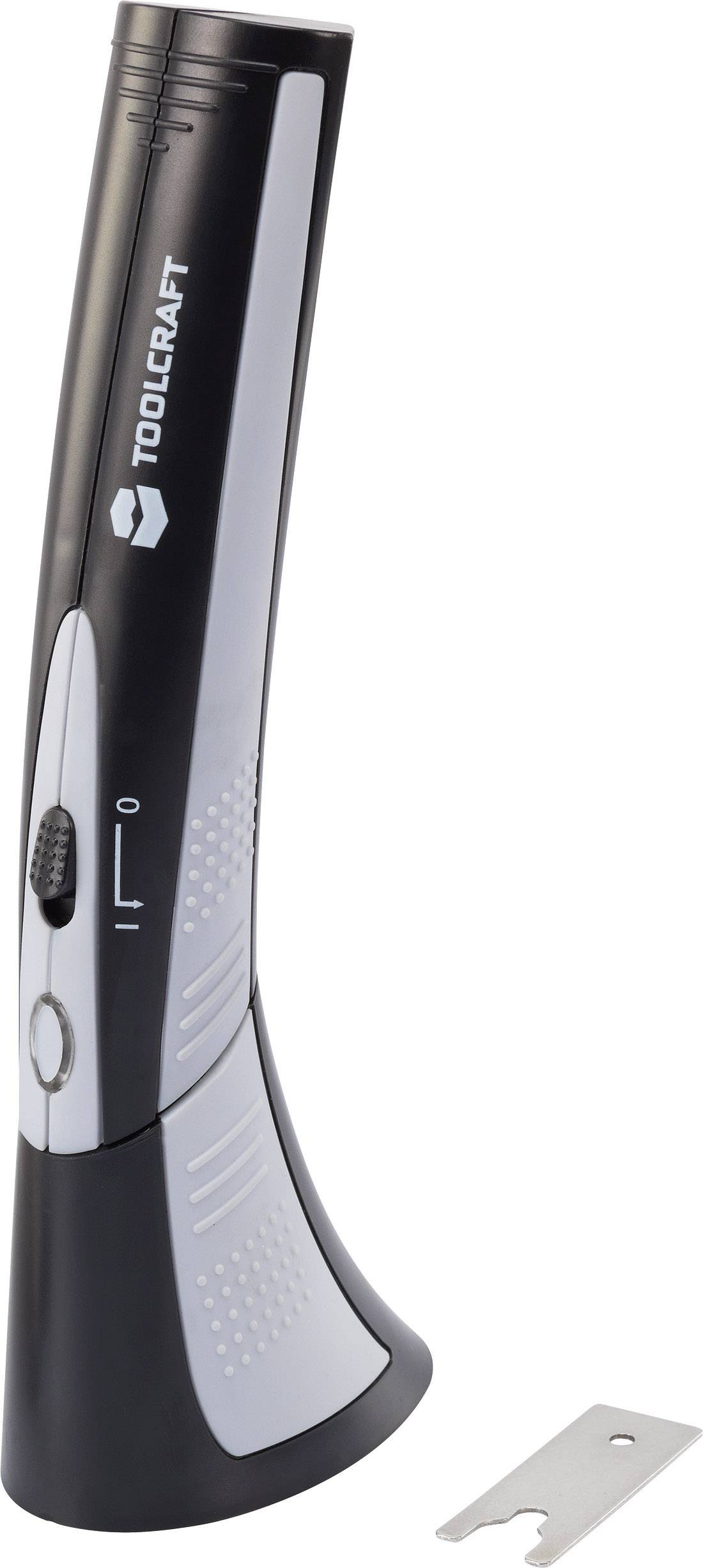 Electric hand planer by TOOLCRAFT, standing upright. Beside it lies a spare blade attachment.