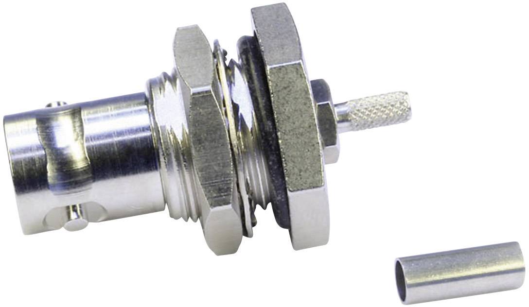 A radio frequency coaxial connector with a nut, seal, and pin is shown. A metal tube lies beside it on a white surface.