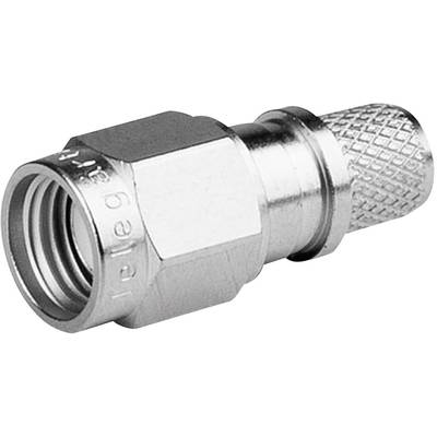 A silver metal adapter, probably a coaxial plug, is lying horizontally. It has a hexagonal end and a knurled end.