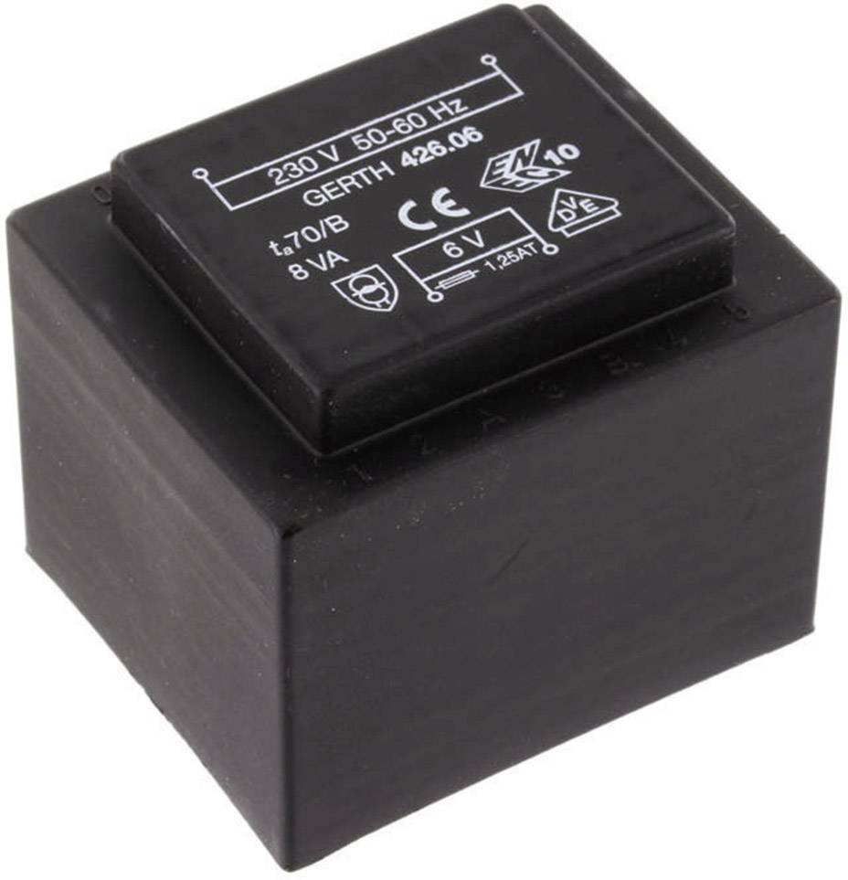 A black transformer with the inscription '230 V 50-60 Hz'. It has a square shape and technical symbols on the top surface.
