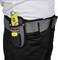 A person is wearing a grey tool belt with a yellow safety tool in a black pouch.