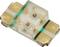 A surface-mount LED with two terminals and a clear casing. The LED is small and is used for electronic applications.