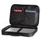 Open black bag with a laptop lying inside and two document compartments containing red and blue paper documents.