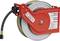 Automatic hose reel with a red housing and black hose, suitable for air and water lines in industrial facilities.