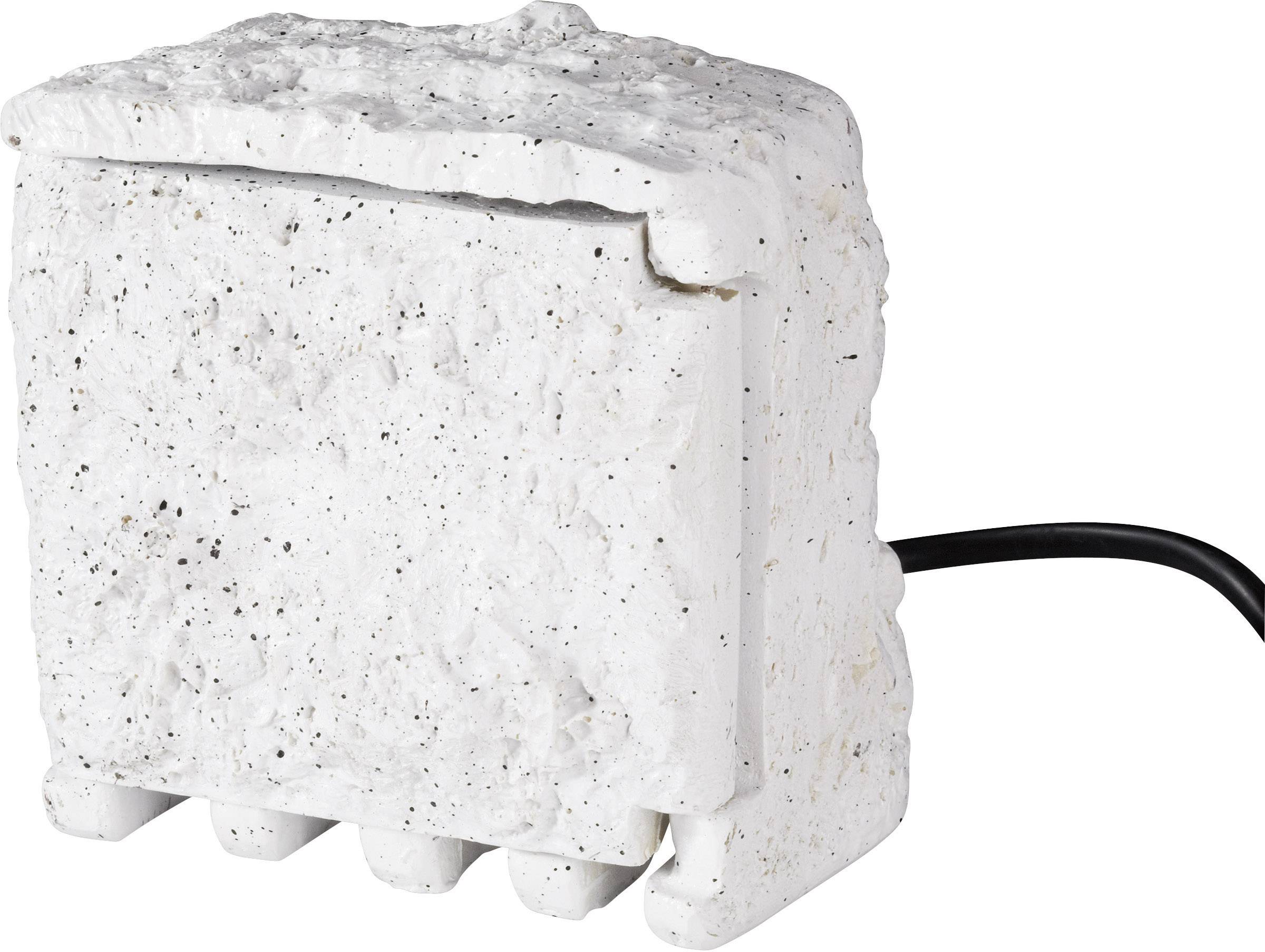 A white, rectangular object with a textured exterior and a black cable at its side.