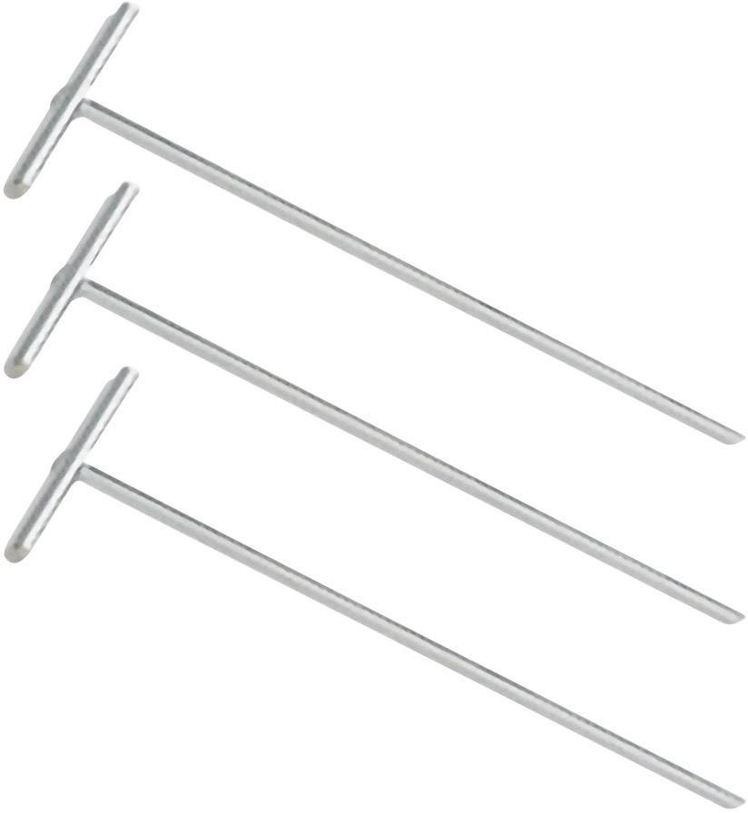 Three silver tent pegs in a T-shape, lying side by side. They are evenly arranged and display a uniform structure.