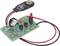 'A simple electronic circuit with resistors, transistors, a red LED and a battery cable.'