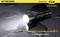 Nitecore CU6 torch illuminating a wet surface. Text: 'Water resistant in accordance with IPX-8 (submersible to 2 metres)', 440 lumens.