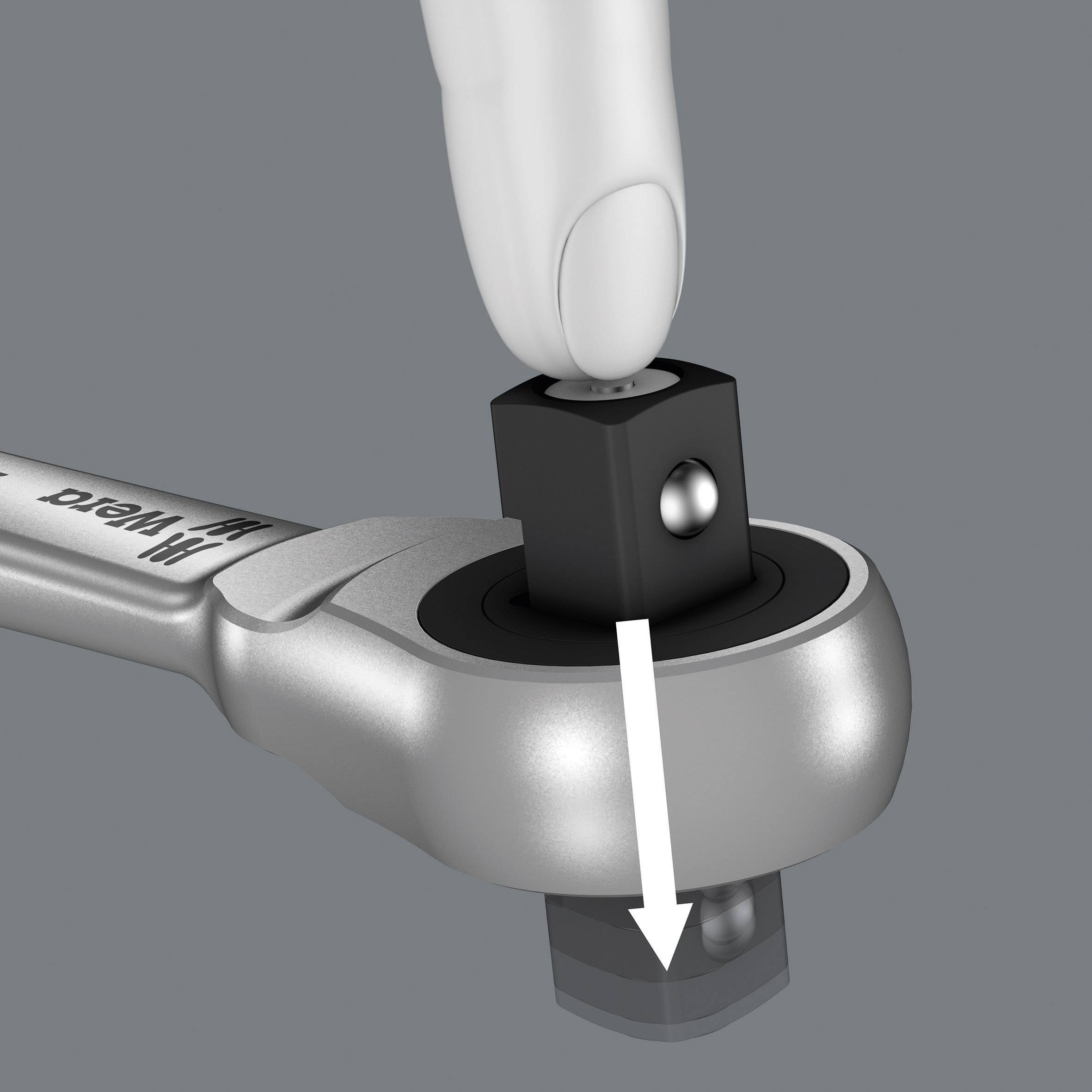 A hand presses down on a socket spanner to loosen or secure a bolt, illustrated by a white arrow.