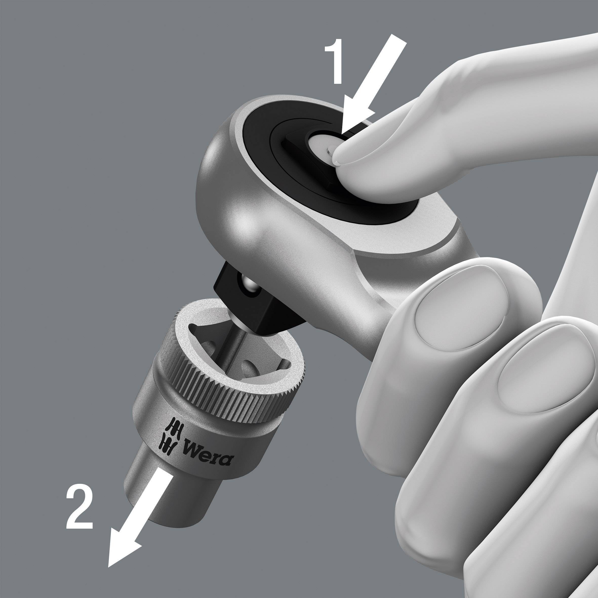 A hand is turning a torque wrench clockwise. An arrow points downwards to the handle.