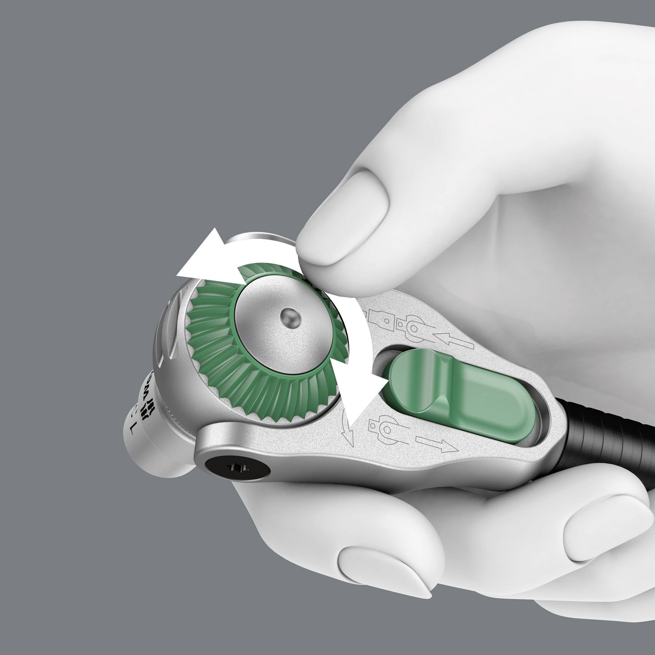 'Close-up of a hand turning a dial with a green marking. Two arrows indicate the direction of rotation.'