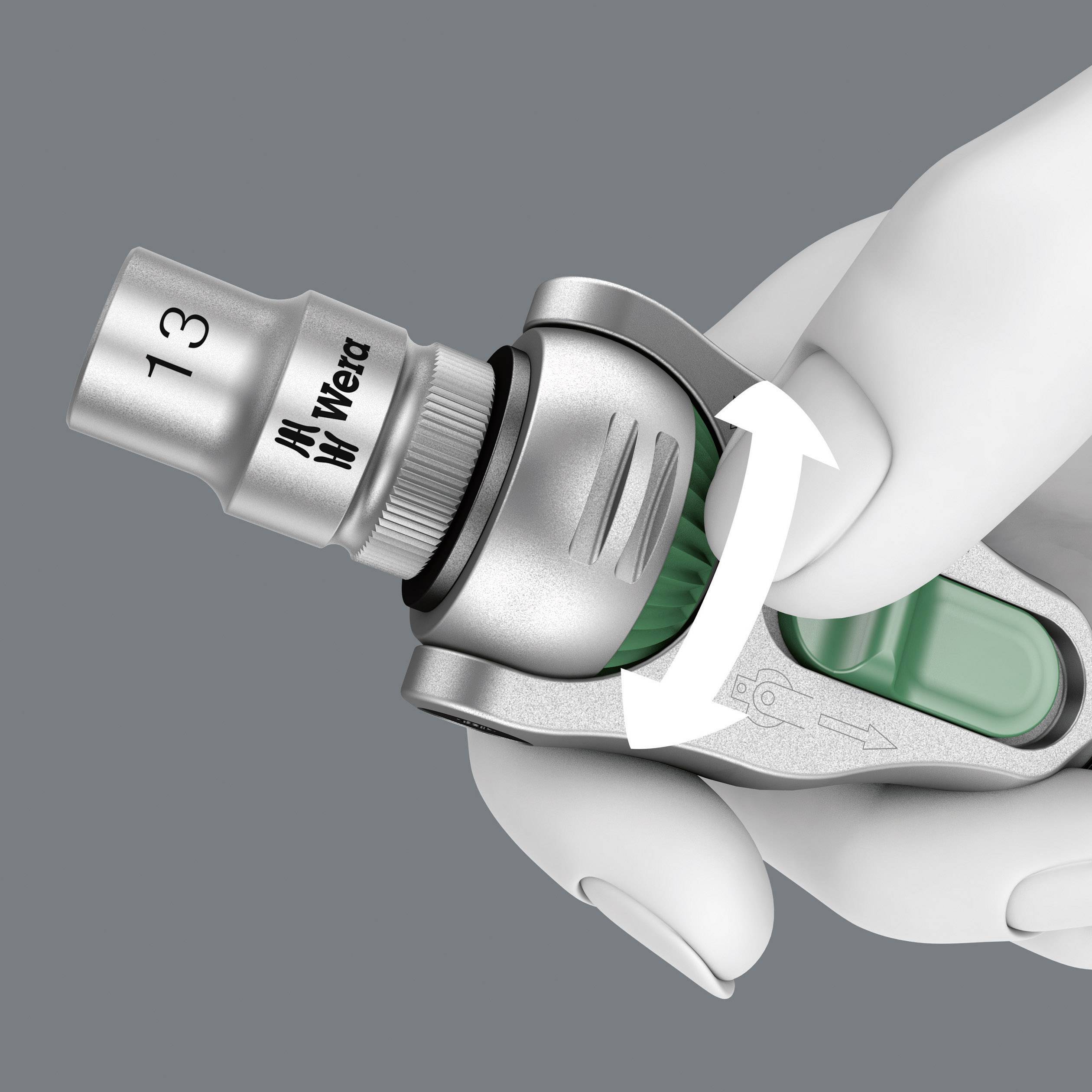 A hand is holding a silver torque wrench with green accents. The tool is labelled with '13' and the manufacturer's name. Arrows indicate the direction of rotation.