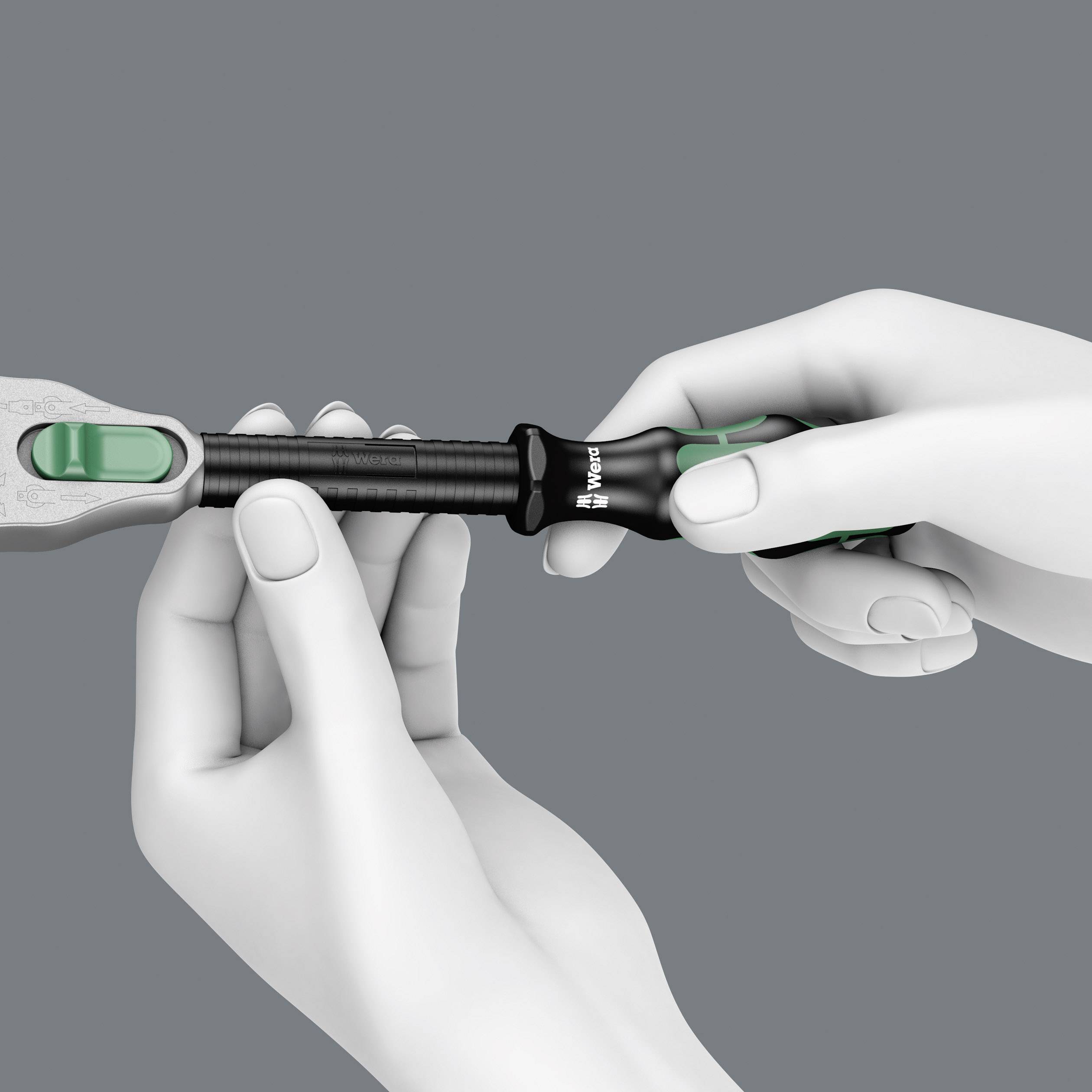 A pair of hands holds a spanner and turns a handle to adjust it. The background is a solid grey.