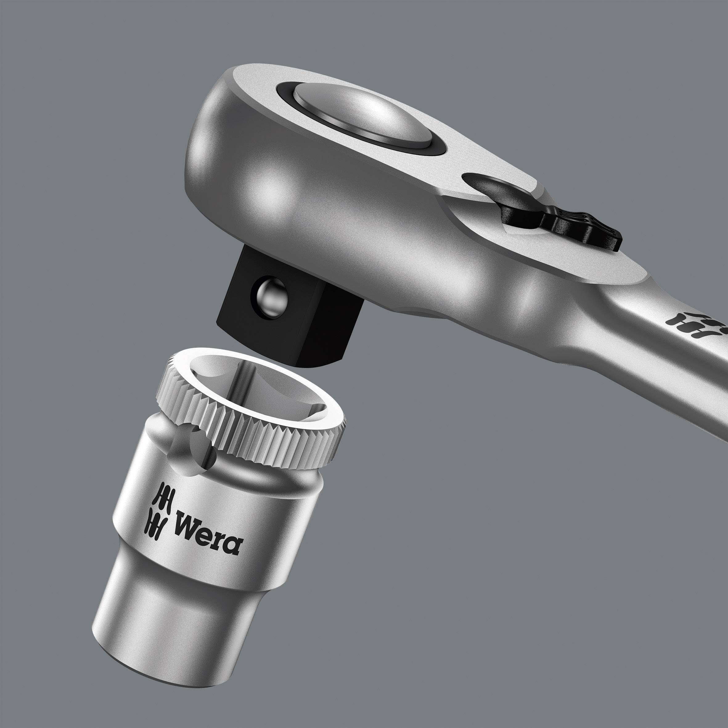 A silver ratchet spanner next to a Wera tool nut, representing the most essential tools for screw-related work.