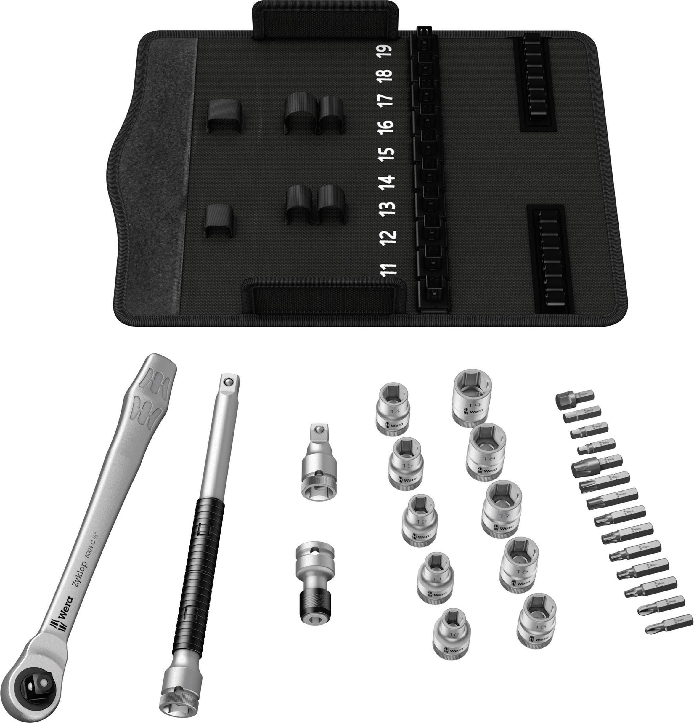 Socket wrench set with ratchet, extensions and bits, carefully organised on a black holder labelled with numbers.
