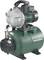 A green Metabo water pump with a pressure vessel, suitable for garden irrigation and water supply, with a visibly mounted pressure gauge.