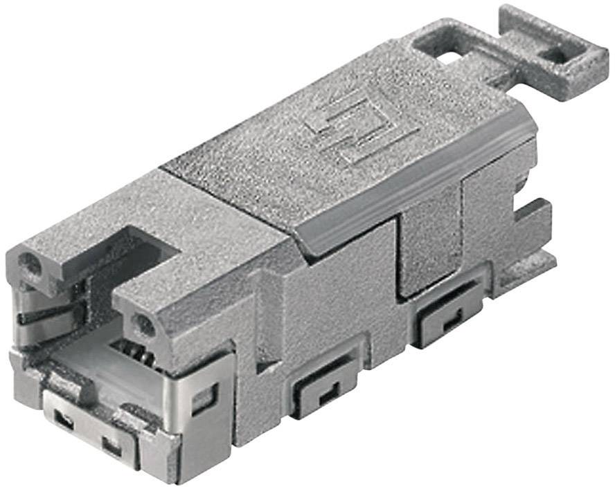 A silver, rectangular electronic plug with multiple connection points and a small handle at the upper end.