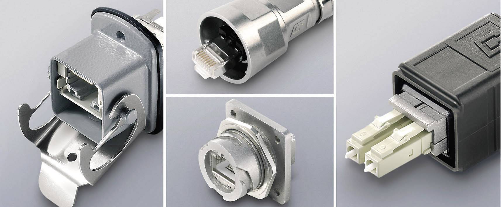 'Various industrial connectors in close-up, including a metal plug with mounting, a cable connector and a fibre-optic connector.'