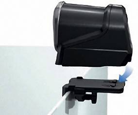 A black device with a lid, attached to an edge, with a cable underneath. It appears to show some kind of connection or security system.