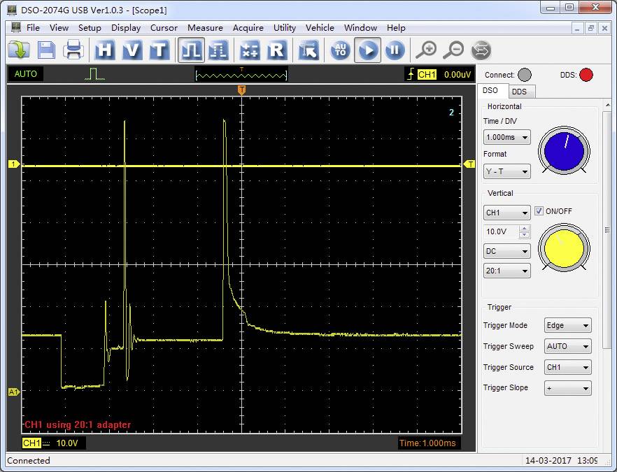 'Oscilloscope displays yellow waveform with peaks and troughs on dark background. Channel settings and time base shown on the right.'
