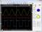 'Oscilloscope display with two waveforms: Yellow sine wave above, red square wave below. Settings on the right with buttons.'